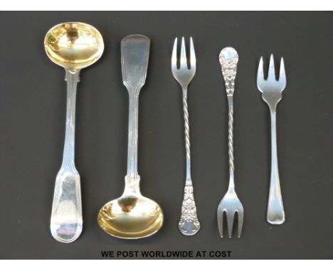 A pair of hallmarked silver cocktail forks, hallmarked silver butter fork and a pair of George IV mustard spoons, London 1824
