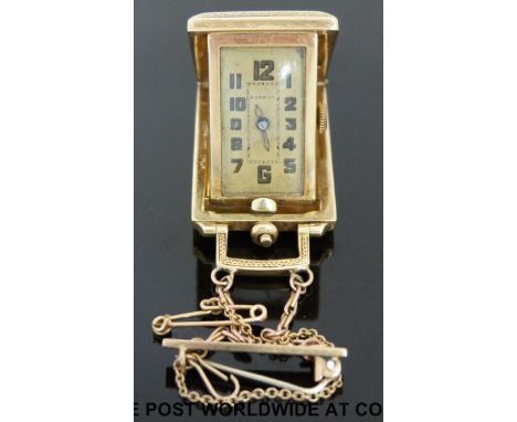 An Eszena ladies Art Deco metamorphic fob watch/travel clock, in engine turned yellow metal case marked 585, with skeleton ha