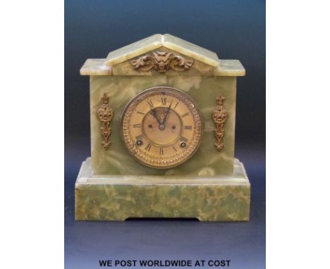 A 19th century green onyx mantel clock, with brass coloured dial, Roman numerals, visible anchor escapement, beetle and poker
