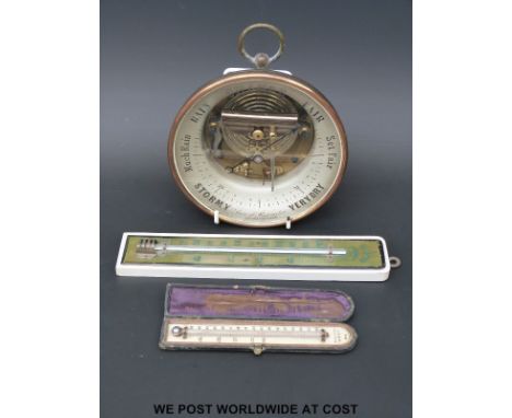 An Issachar, Cheltenham, glass faced aneroid brass cased barometer (16.5cm diameter) together with a cased WM Bell, Cheltenha