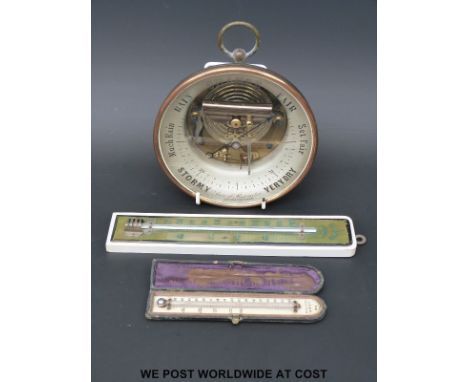 An Issachar, Cheltenham, glass faced aneroid brass cased barometer (16.5cm diameter) together with a cased WM Bell, Cheltenha