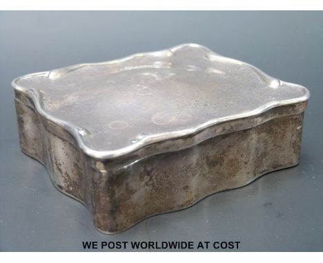 A hallmarked silver shaped ring box with fitted plush interior, Birmingham 1910, maker A & J Zimmerman (width 9cm)
