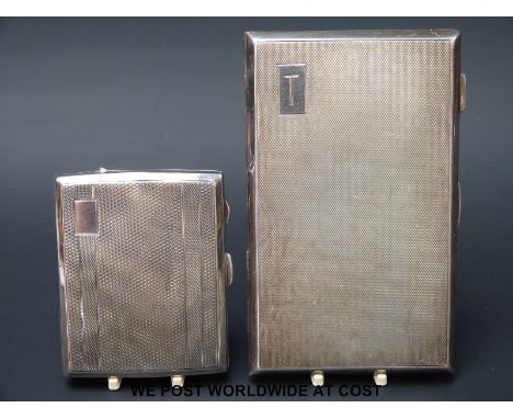 Two hallmarked silver engine turned cigarette cases (324g)