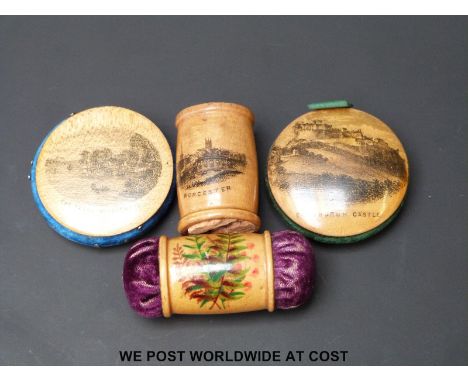 Four Mauchline ware pin cushions featuring Edinburgh Castle, Worcester, Stock Ghyll Force, Ambleside and a florally decorated