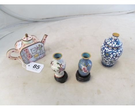 An enamel teapot and three cloisonné vases