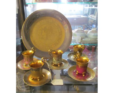 A D.W. Porzelin plate and five cups with saucers