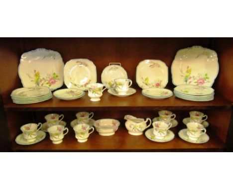 A Royal Paragon Souvenir teaset made to commemorate the birth of Princess Margaret Rose; two bread and butter plates, twelve 