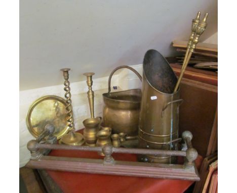 Two brass coal scuttles, candlesticks, fireguard, fender et cetera