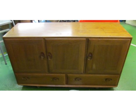 A light wood Ercol sideboard