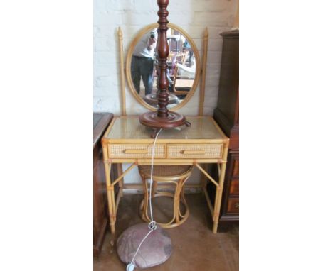 A small bamboo and cane dressing table with oval mirror and a matching stool