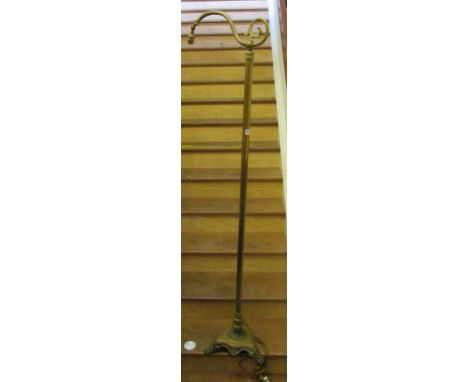 A brass floor standard lamp