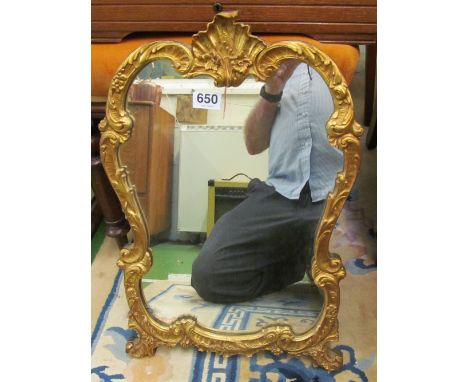 A small gilt mirror