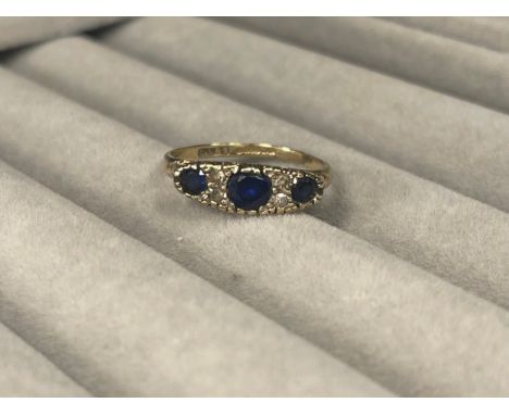 9ct Gold fully hallmarked Three Stone Sapphire Ring weighing 2.2 grams Size M 