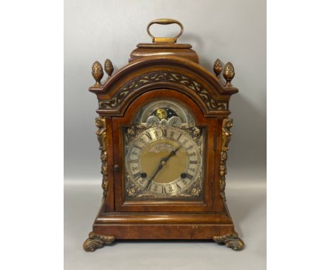 Antique 1920s English wooden mantle clock by John Smith of London with brass accents 