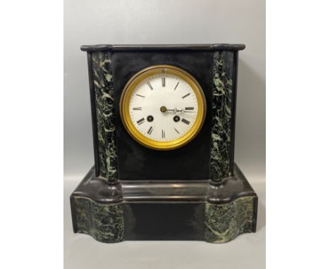 Large heavy black marble French mantle clock with brass bezel 
