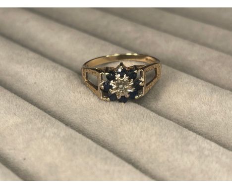 9ct Sapphire Cluster Ring with Diamond Centre Stone Weighing 2.34 grams Size M 