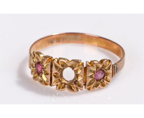 Yellow metal ring, set with two rubies, central stone missing, 1.4 grams