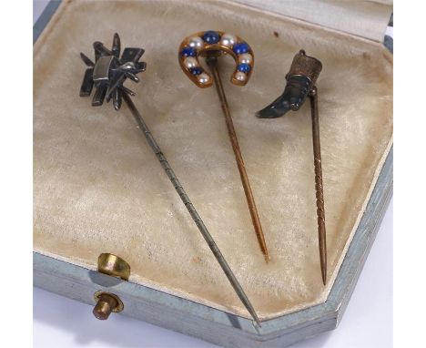 Three stick pins, to include a horse shoe example, a boot and one with tools, (3)