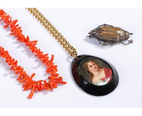 Jewellery, to include a coral necklace, a silver beetle brooch and a portrait pendant, (3)