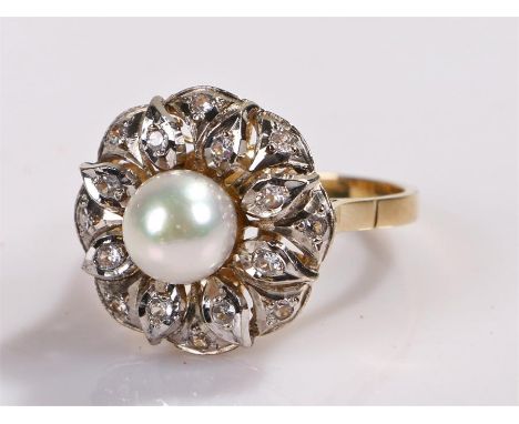 18 carat gold pearl and diamond ring, the central pearl with a flower head design set with round cut diamonds, ring size O