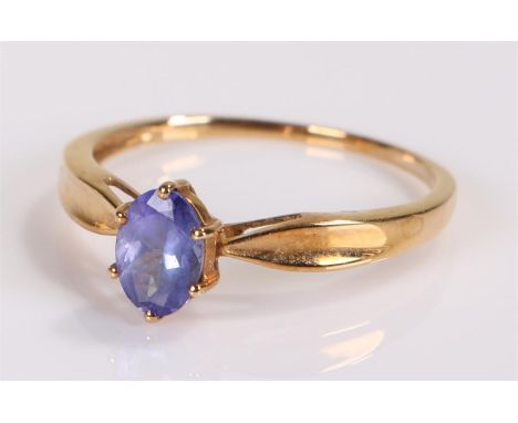 9 carat gold ring, with a blue stone set the centre, ring size T