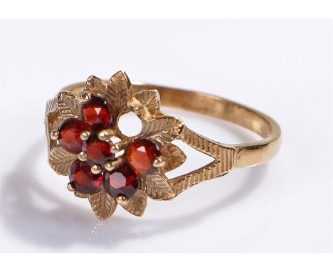 9 carat gold ring, set with red stones, one missing, 2.6 grams