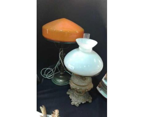 Cast brass oil lamp with glass chimney and shade, together with a brass electric lamp with orange glass shade, (2)