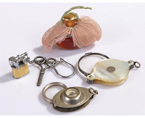 Mother of pearl eye glass together with a Lalique perfume bottle, a compass and a miniature lighter, (4)