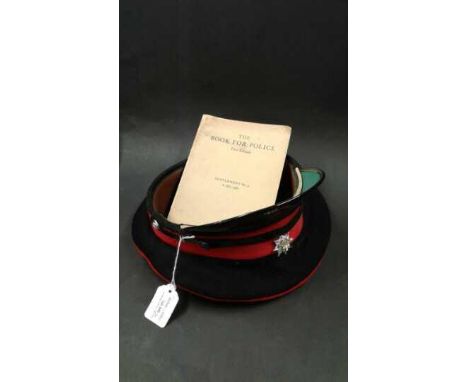 British Army service dress cap badged to the Royal Anglian Regiment, together with The Book for Police, supplement No 4 1962,