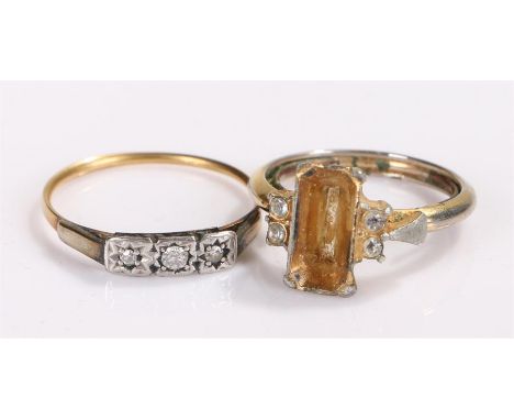 Yellow metal diamond set ring, the head set with three diamonds, together with a costume ring missing the central stone, (2)