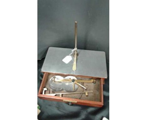 A set of early 20th century apothecary scales labelled De Grave Short, London England