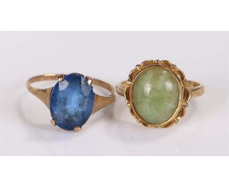 Two 9 carat gold rings, the first set with a blue paste stone, the second with a jade stone, (2)