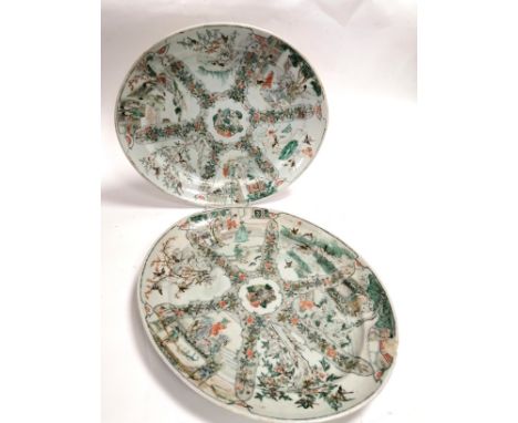 A pair of Chinese famille verte oval serving dishes,  with overglaze enamel design of cartouches of figures in a garden divid