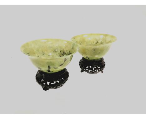 A pair of spinach jade style Chinese glass bowls,   diameter 11cm, together with a similar tripod censer (3) 