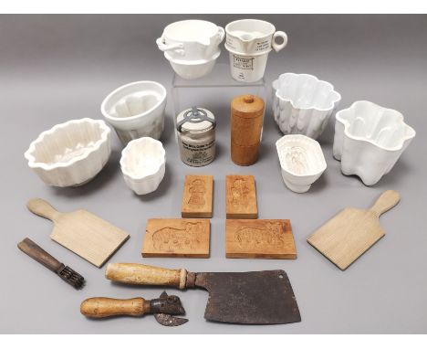 An assortment of kitchenalia, to include jelly moulds, utensils and scales.