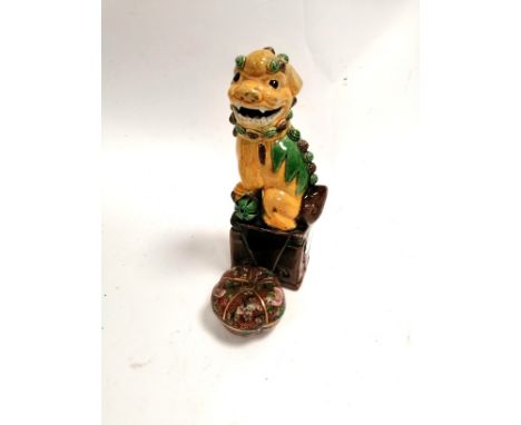 A cloisonné enamel covered pot in the form of a pumpkin,  together with a sancai glazed Dog of Fo,  height 19cm