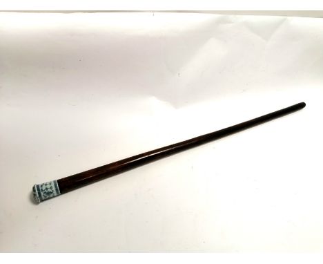 A walking stick inset with a blue and white Chinese porcelain,  having a floral design with a key fret meander pattern, lengt