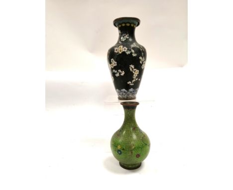 Two Chinese cloisonné enamel vases,  one on a black ground, one on a green ground, with blossoming branches, the tallest 23.5