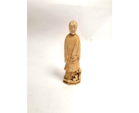 A Chinese marine ivory carving of a lady with an umbrella, probably walrus, with a young child and dog playing at her feet, h