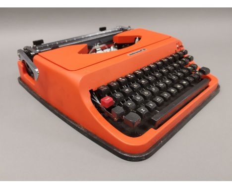 A cased Underwood 35 portable typewriter, finshed in bright orange.