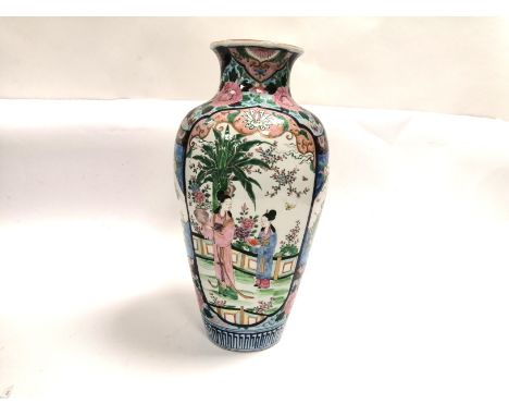 A Japanese polychrome enamel vase of substantial proportions with two cartouches of beauties in a garden,  divided by panels 