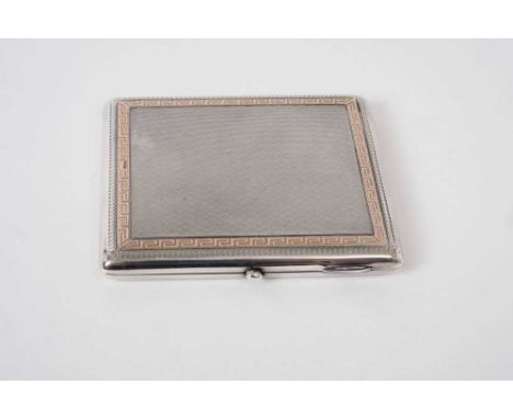 Good quality George V silver cigarette case of rectangular cushion form with engine turned decoration and gold Greek key bord
