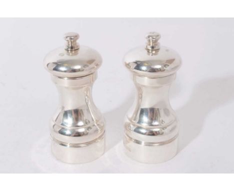 Pair of contemporary silver pepper grinders of traditional form 10.5 cm