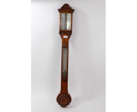 Late Victorian oak stick barometer/thermometer in decorative carved case,102cm high.