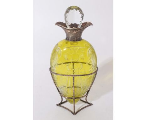 Victorian yellow overlaid cut glass decanter of amphora form with unusual decoration depicting the face of a man, with silver