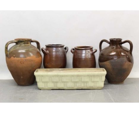 French ceramic window box, 63cm wide, together with two Macedonian terracotta jars and two French twin handled jars