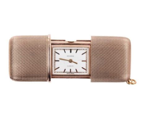 1960s Mavado 9ct gold purse watch with silvered dial signed Mavado Ermeto in sliding engine turned case, 40 mm closed.