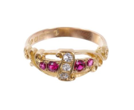 Edwardian ruby and diamond ring with a scroll of three old cut diamonds flanked by four mixed-cut rubies, carved gold scroll 