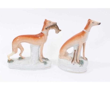 Two Victorian Staffordshire figures of greyhounds, the largest measuring 21cm heightCondition report: One has some restoratio