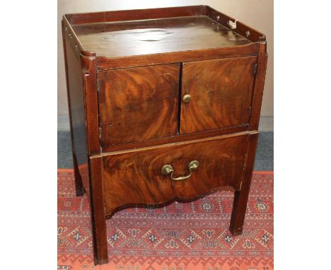 George III mahogany tray top bedside commode, with pierced gallery and enclosed by pair of cupboard doors with pot drawer bel